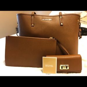 Michael Kors travel bag, wristlet and wallet.